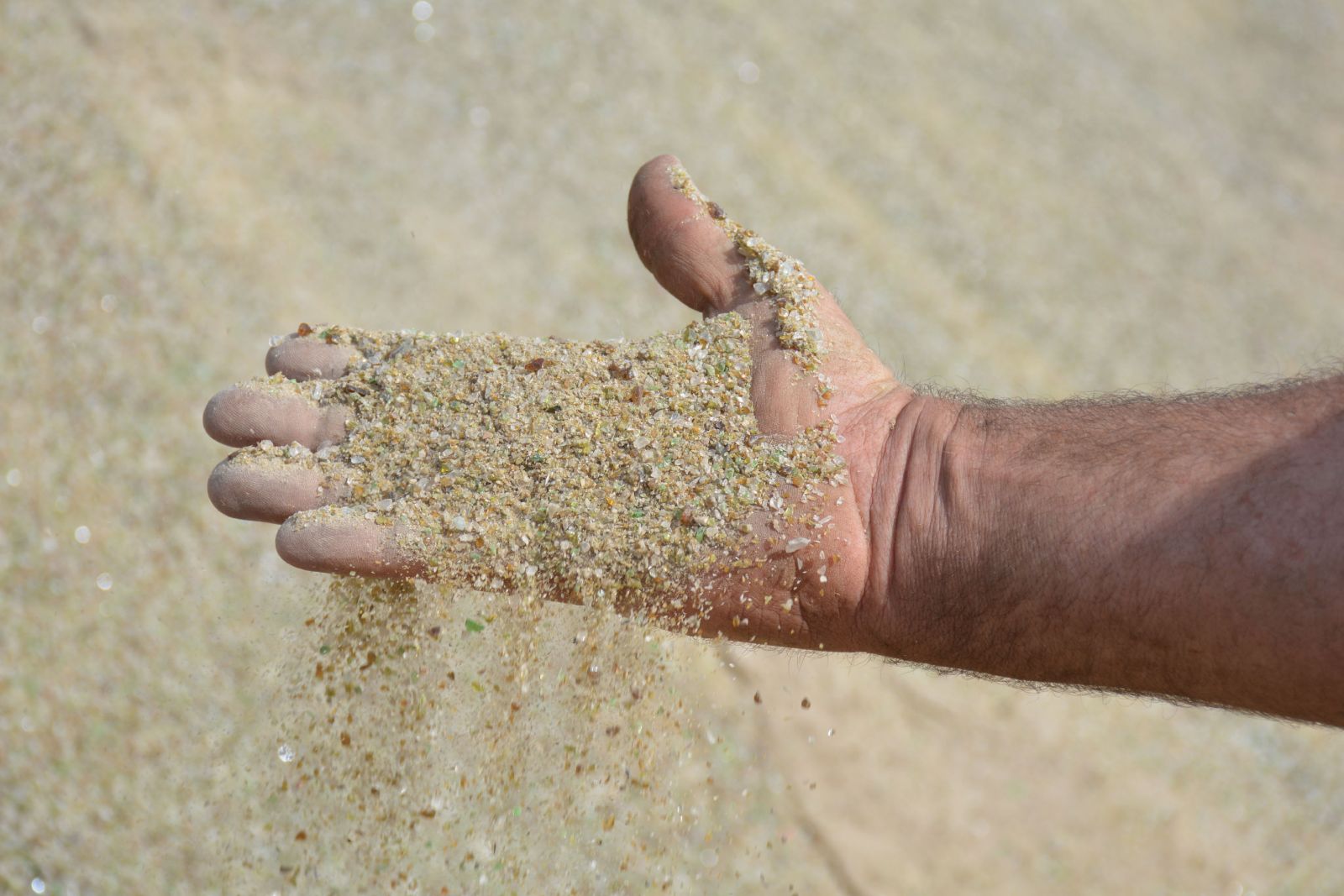 Recycled Glass Sand shown on Tim's hand