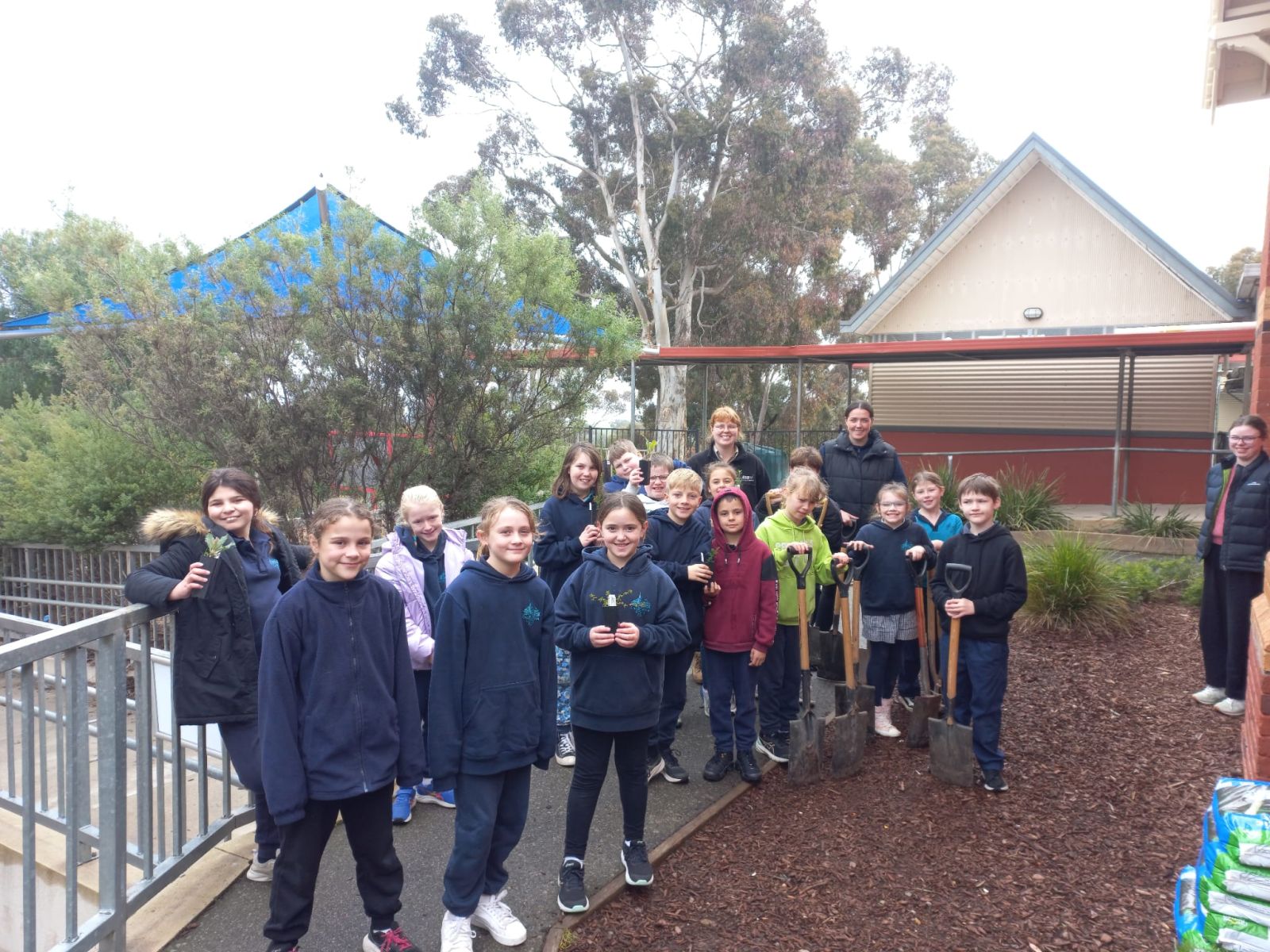 Rose shown with students ready for a day of planting