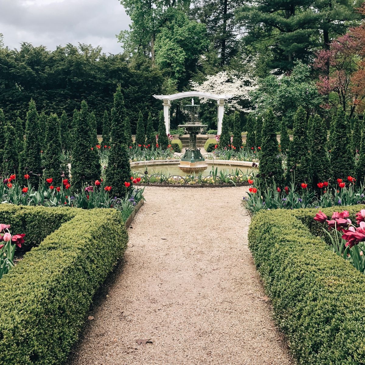 Fountain and path in english style garden 